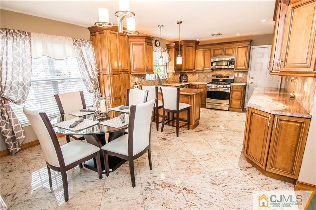 19 Mapleton Road Old Bridge, NJ 08857 - Photo 14 of 25 a view of a dining room with furniture window and outside view