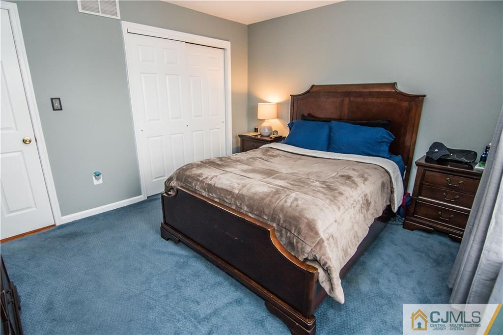 19 Mapleton Road Old Bridge, NJ 08857 - Photo 22 of 25 a bed sitting in a bedroom next to a window