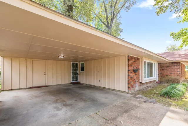 a view of an empty room with a garage