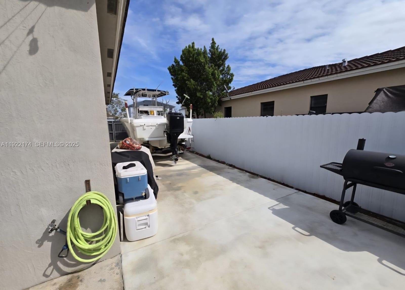 27862 Southwest 134th Court Homestead, FL 33033 - Photo 14 of 14 a view of a room with gym equipment