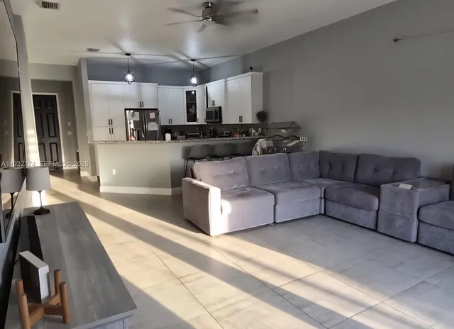 a living room with furniture and a couch
