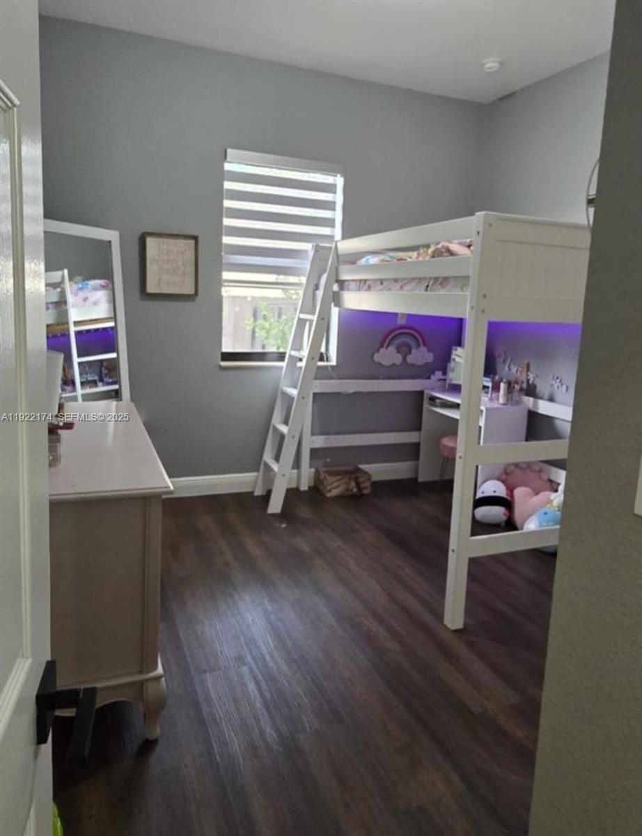 27862 Southwest 134th Court Homestead, FL 33033 - Photo 9 of 14 a bedroom with a bed and a window