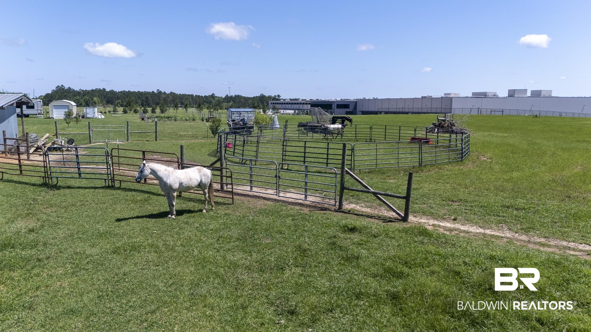 30580 County Road 49 Loxley, AL 36551 - Photo 27 of 32 Expansive green pastures with multiple metal-gated enclosures