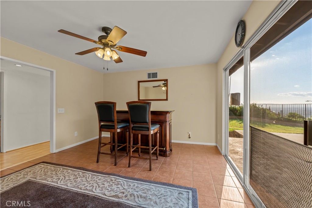 9869 Lanark Street Sun Valley, CA 91352 - Photo 11 of 22 a view of a dining room with furniture window and wooden floor