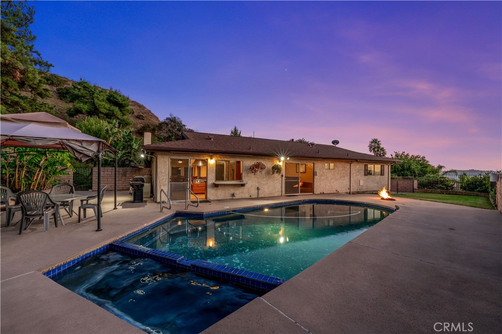 9869 Lanark Street Sun Valley, CA 91352 - Photo 13 of 22 a view of a house with swimming pool and sitting area