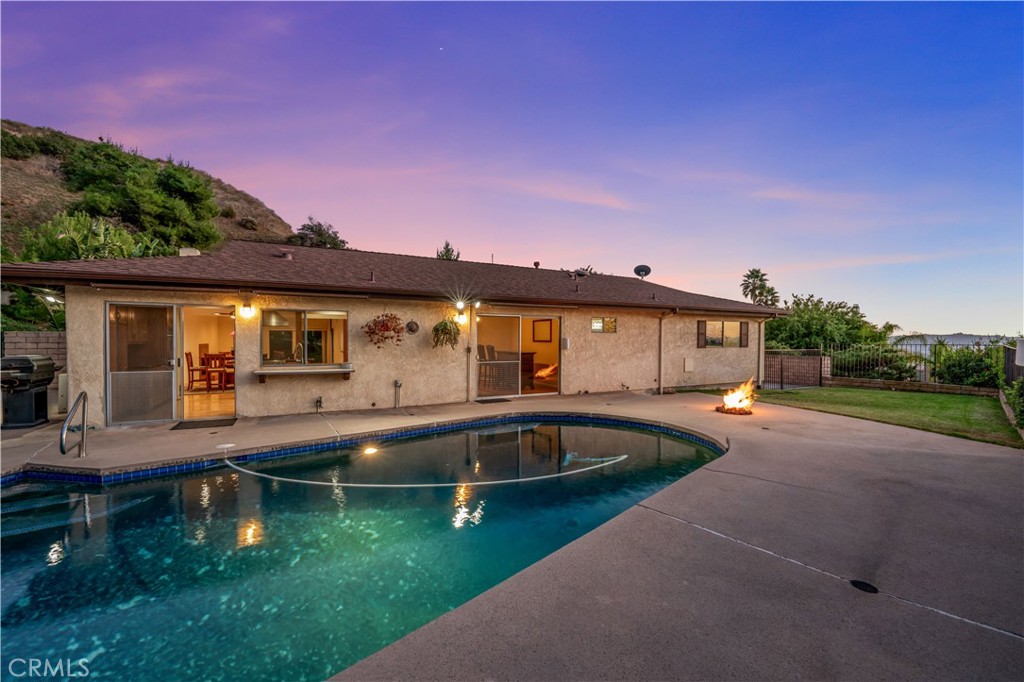9869 Lanark Street Sun Valley, CA 91352 - Photo 14 of 22 a front view of a house with swimming pool yard and outdoor seating