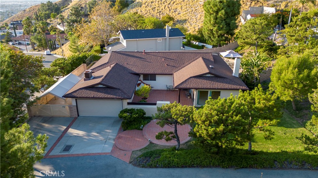 9869 Lanark Street Sun Valley, CA 91352 - Photo 19 of 22 a view of a house with a yard plants and large tree