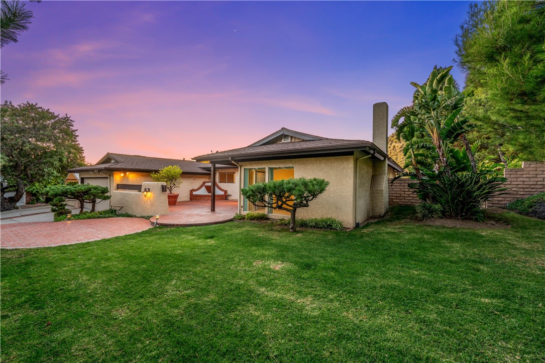 9869 Lanark Street Sun Valley, CA 91352 - Photo 3 of 22 a backyard of a house with table and chairs