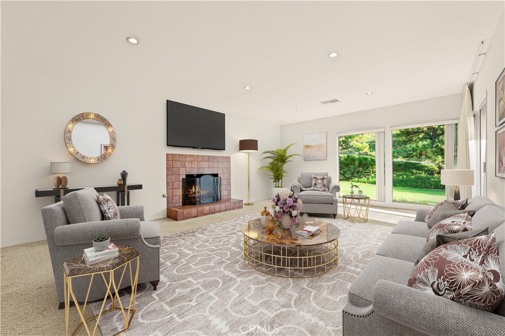 9869 Lanark Street Sun Valley, CA 91352 - Photo 6 of 22 a living room with furniture fireplace and a large window