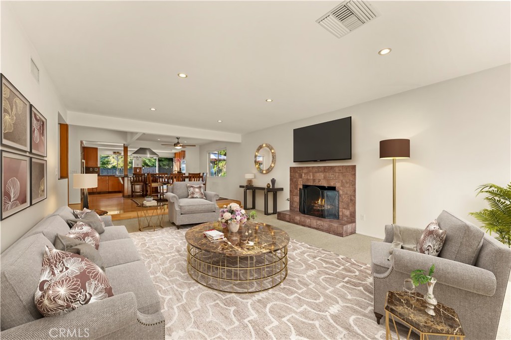 9869 Lanark Street Sun Valley, CA 91352 - Photo 7 of 22 a living room with furniture fireplace and a flat screen tv