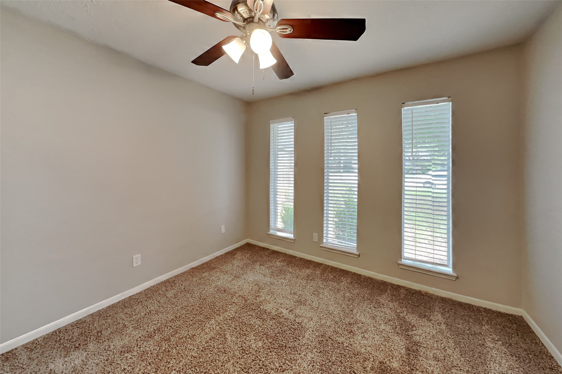 29307 Atherstone Street Spring, TX 77386 - Photo 17 of 22 an empty room with windows and fan