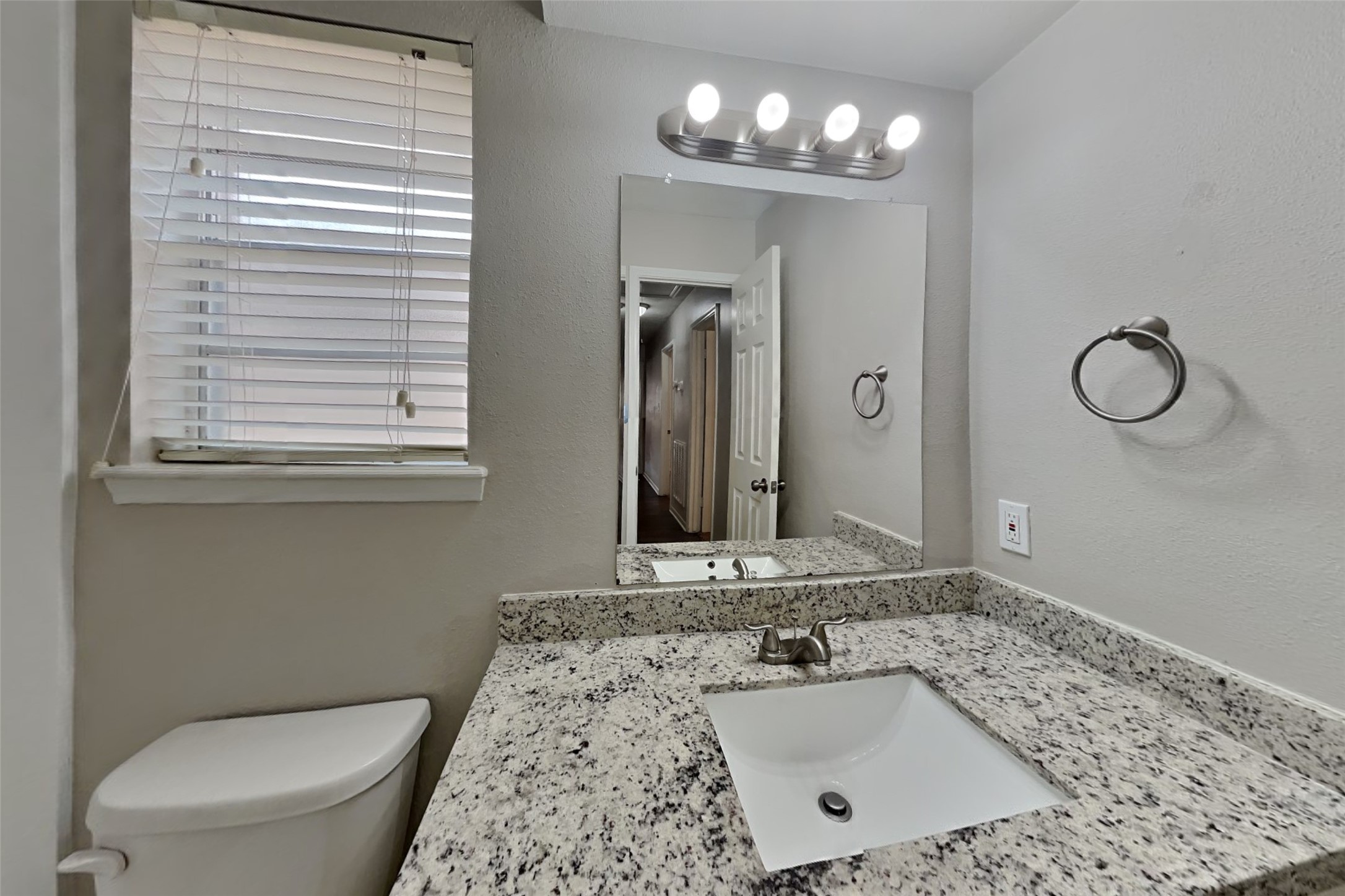 29307 Atherstone Street Spring, TX 77386 - Photo 19 of 22 a bathroom with a sink a toilet and mirror