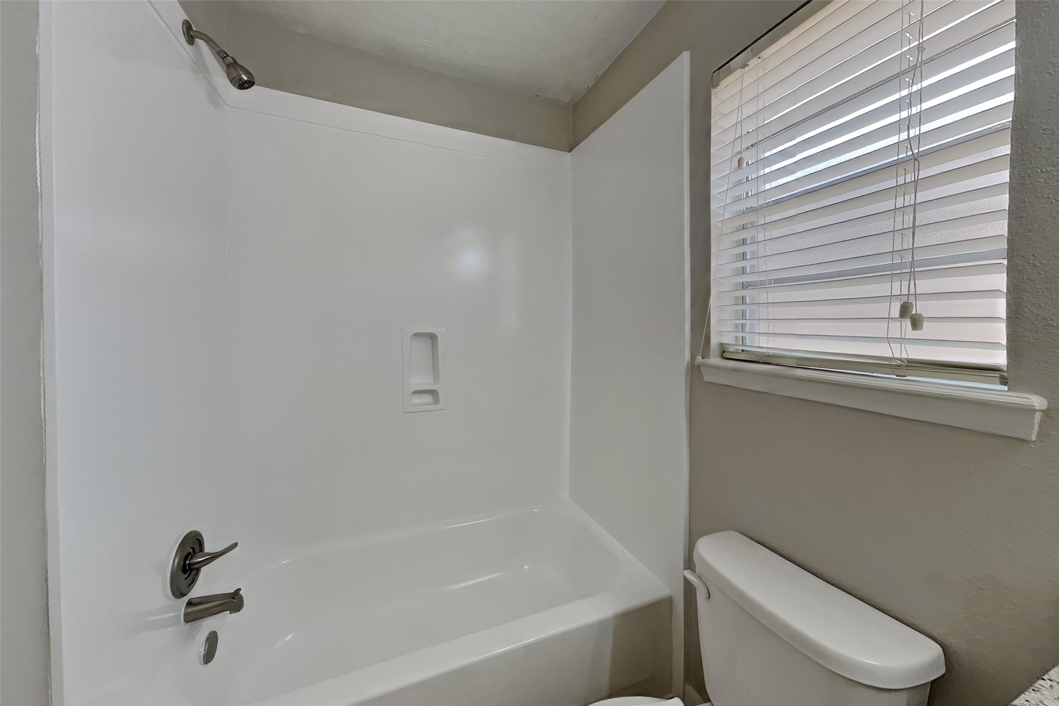 29307 Atherstone Street Spring, TX 77386 - Photo 20 of 22 a white bath tub sitting next to a toilet