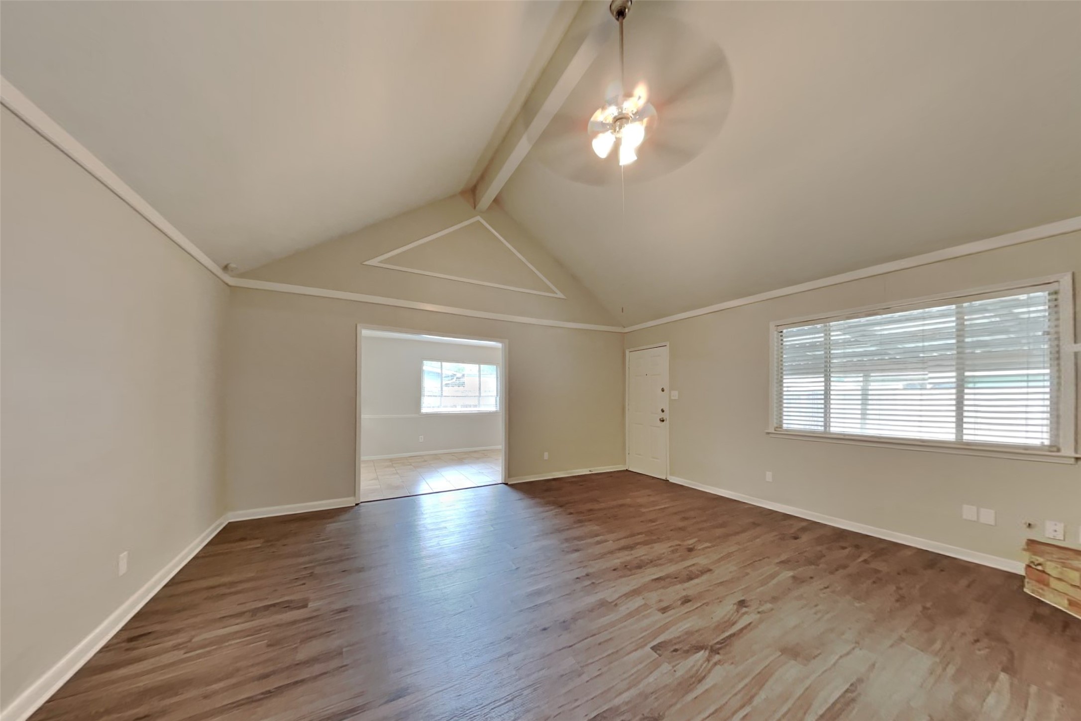 29307 Atherstone Street Spring, TX 77386 - Photo 3 of 22 an empty room with wooden floor and windows