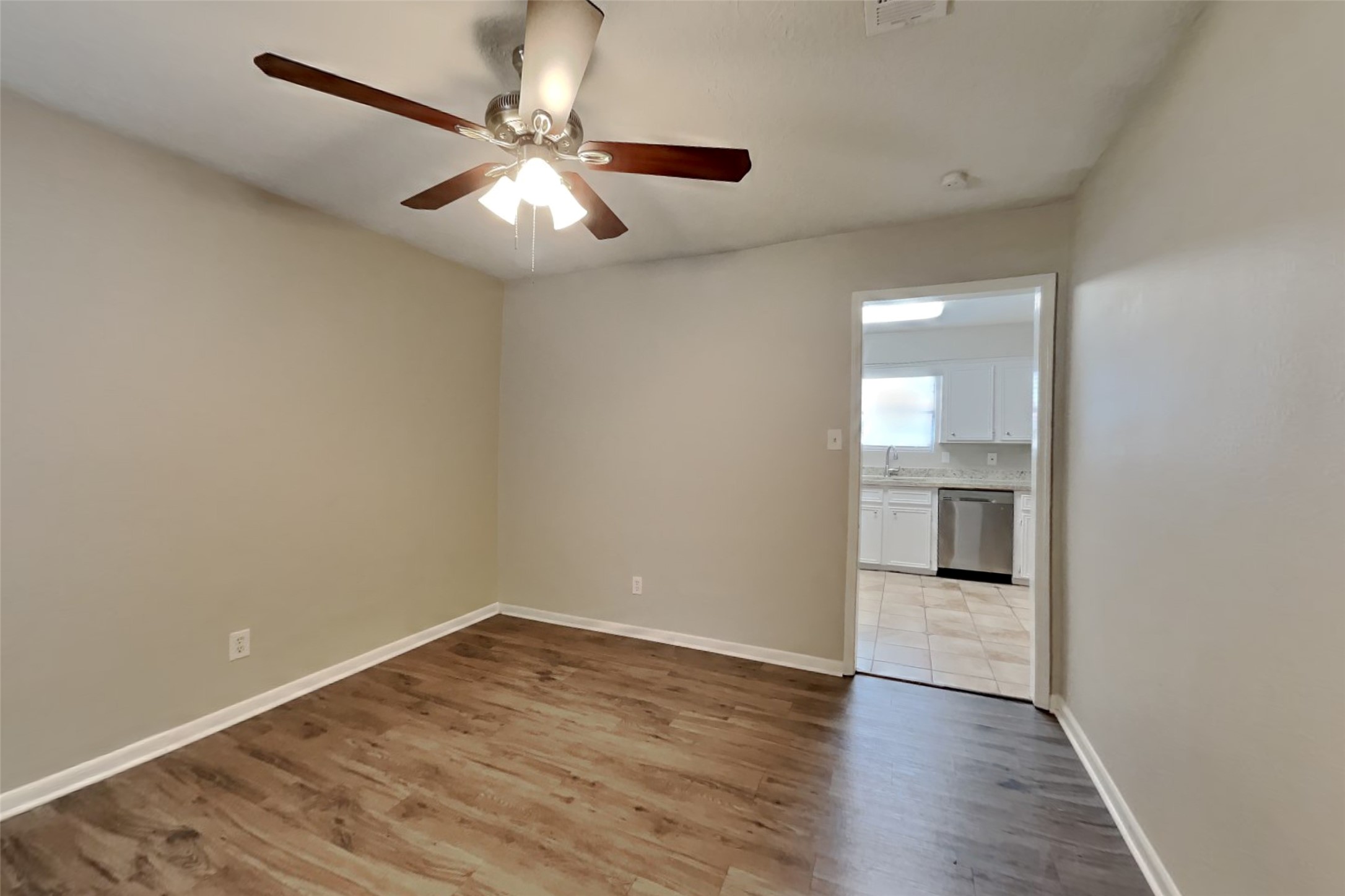 29307 Atherstone Street Spring, TX 77386 - Photo 8 of 22 an empty room with wooden floor and windows