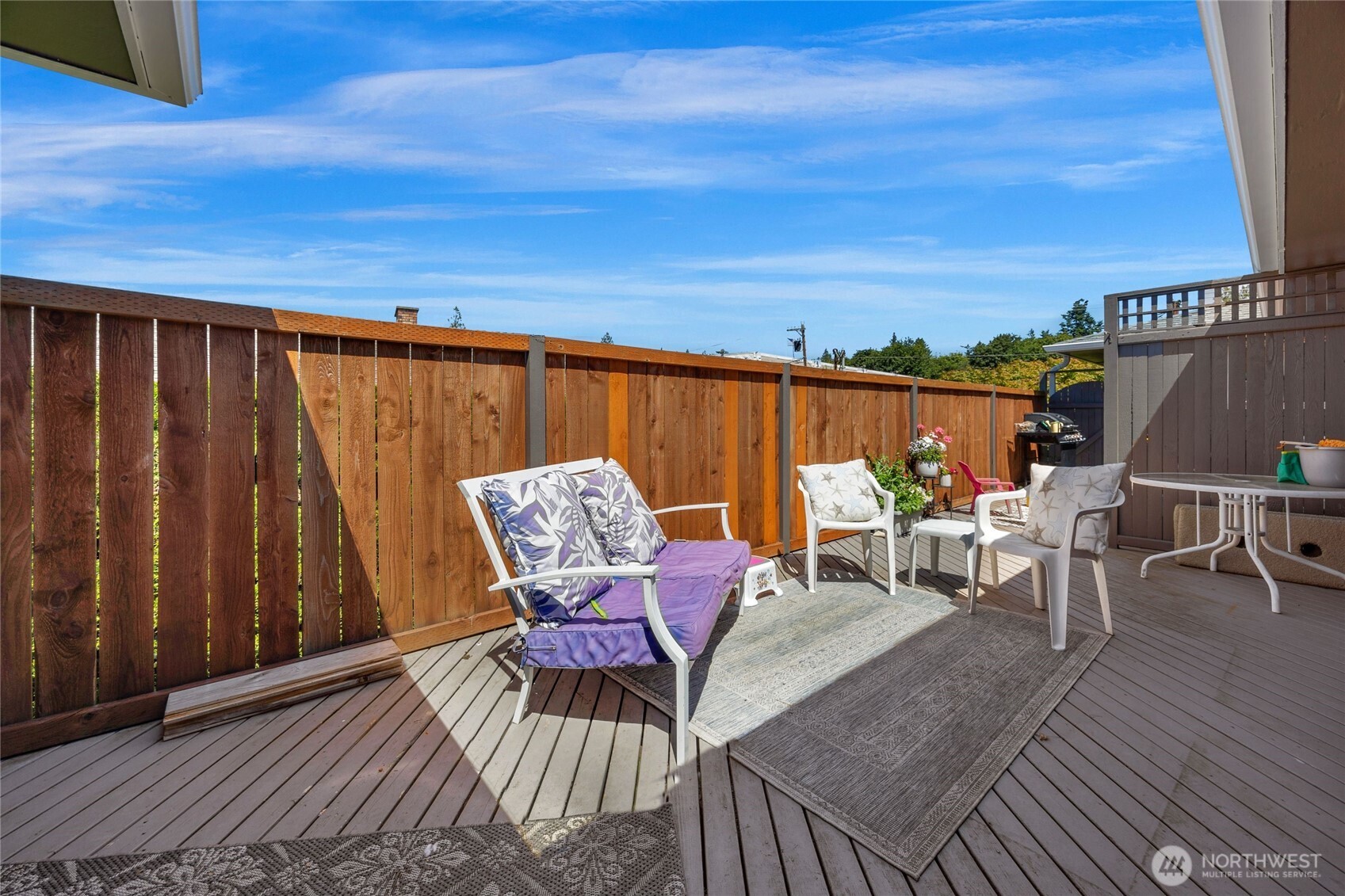 205 Heather Road Everett, WA 98203 - Photo 17 of 40 a roof deck with a table and chairs