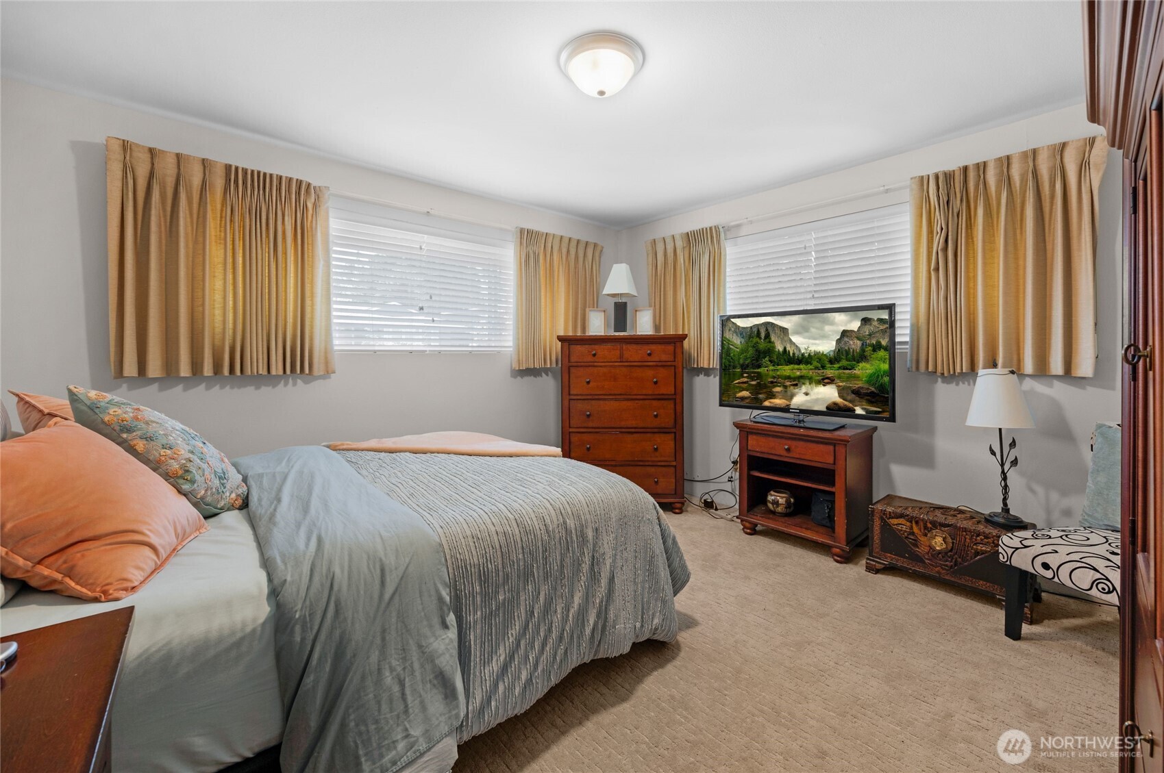 205 Heather Road Everett, WA 98203 - Photo 21 of 40 a bedroom with a bed and a television