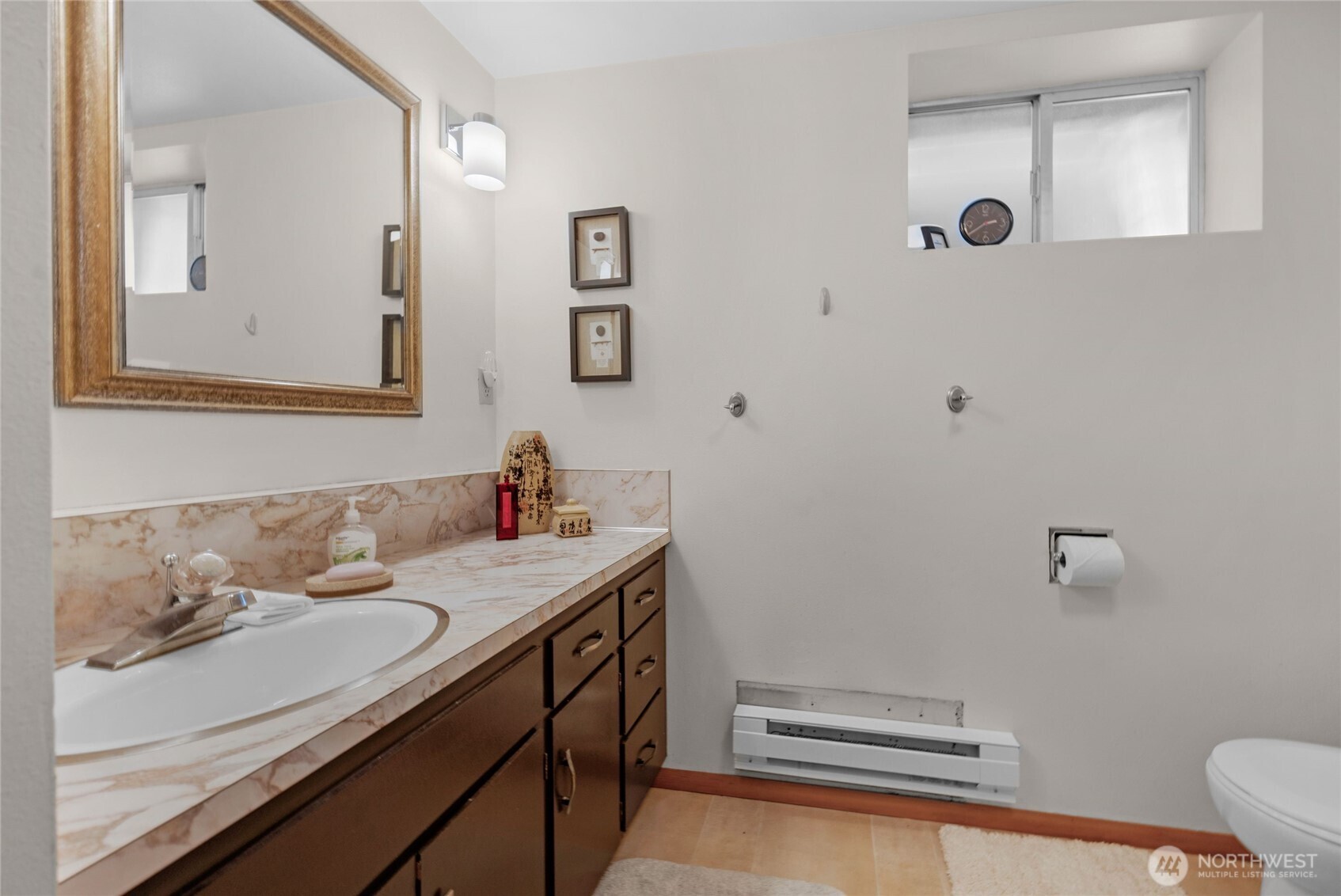 205 Heather Road Everett, WA 98203 - Photo 25 of 40 a bathroom with a sink and a mirror