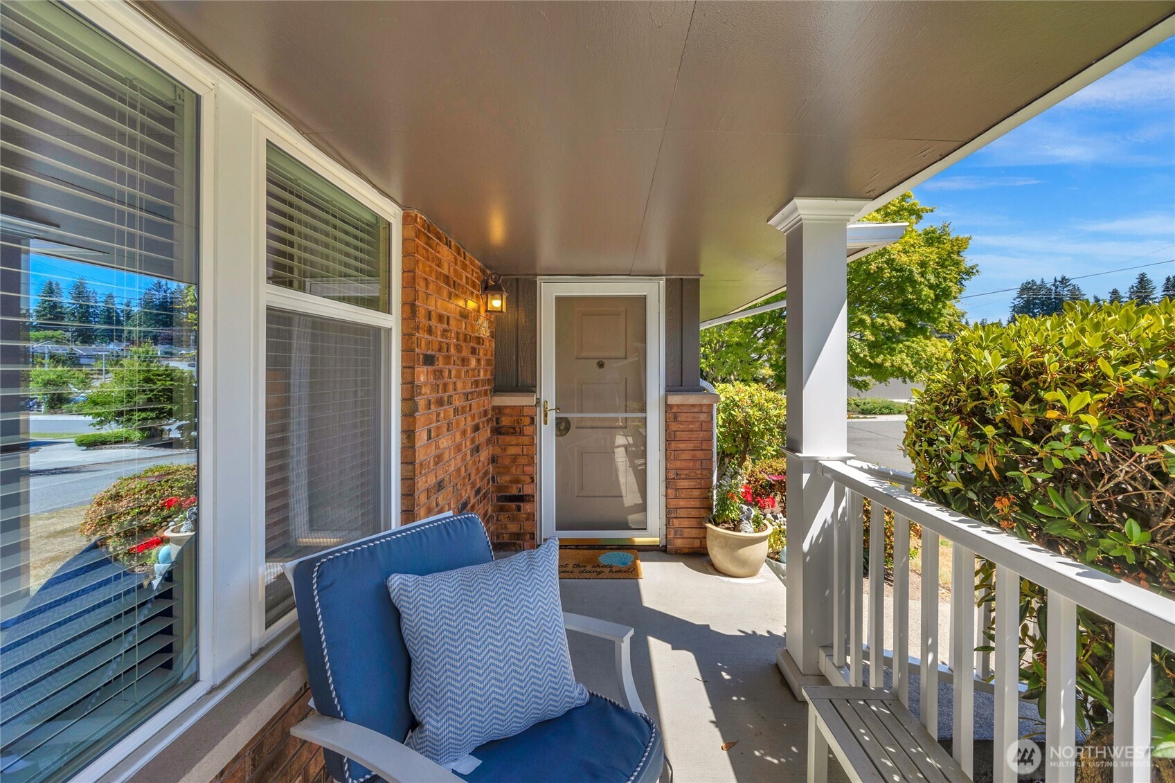 205 Heather Road Everett, WA 98203 - Photo 26 of 40 a view of a porch with furniture and a yard