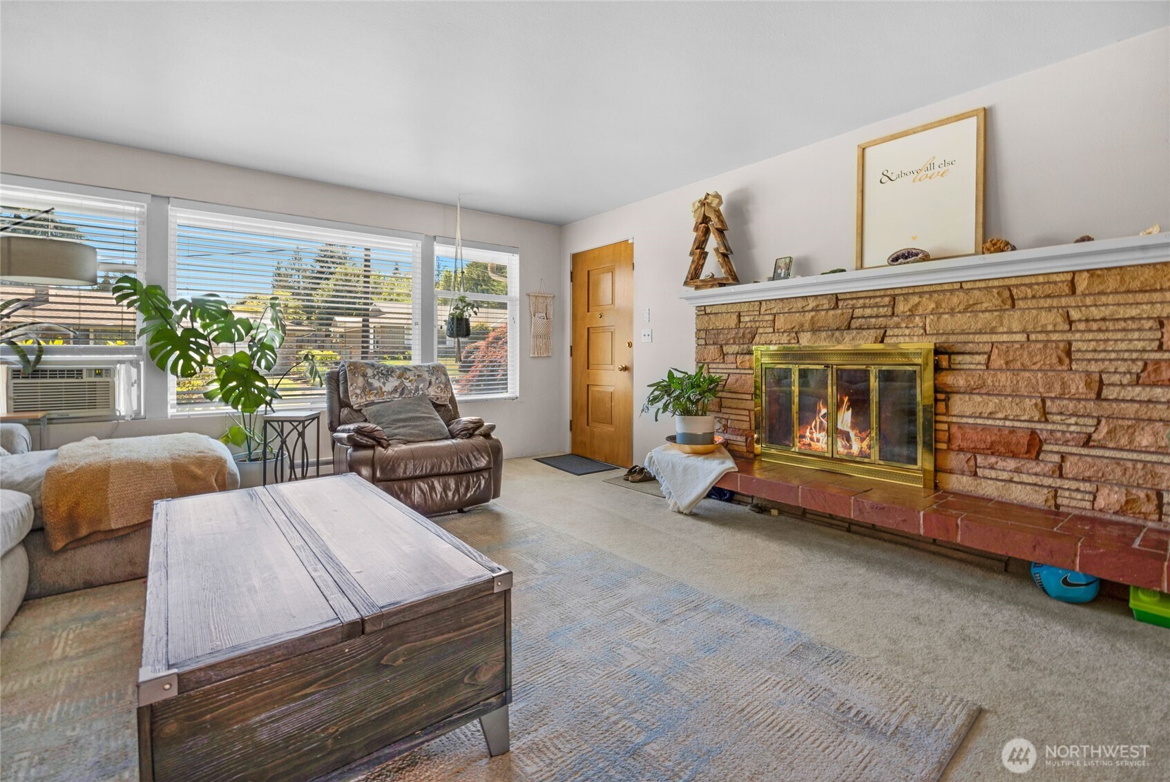 205 Heather Road Everett, WA 98203 - Photo 27 of 40 a bedroom with furniture and a fireplace