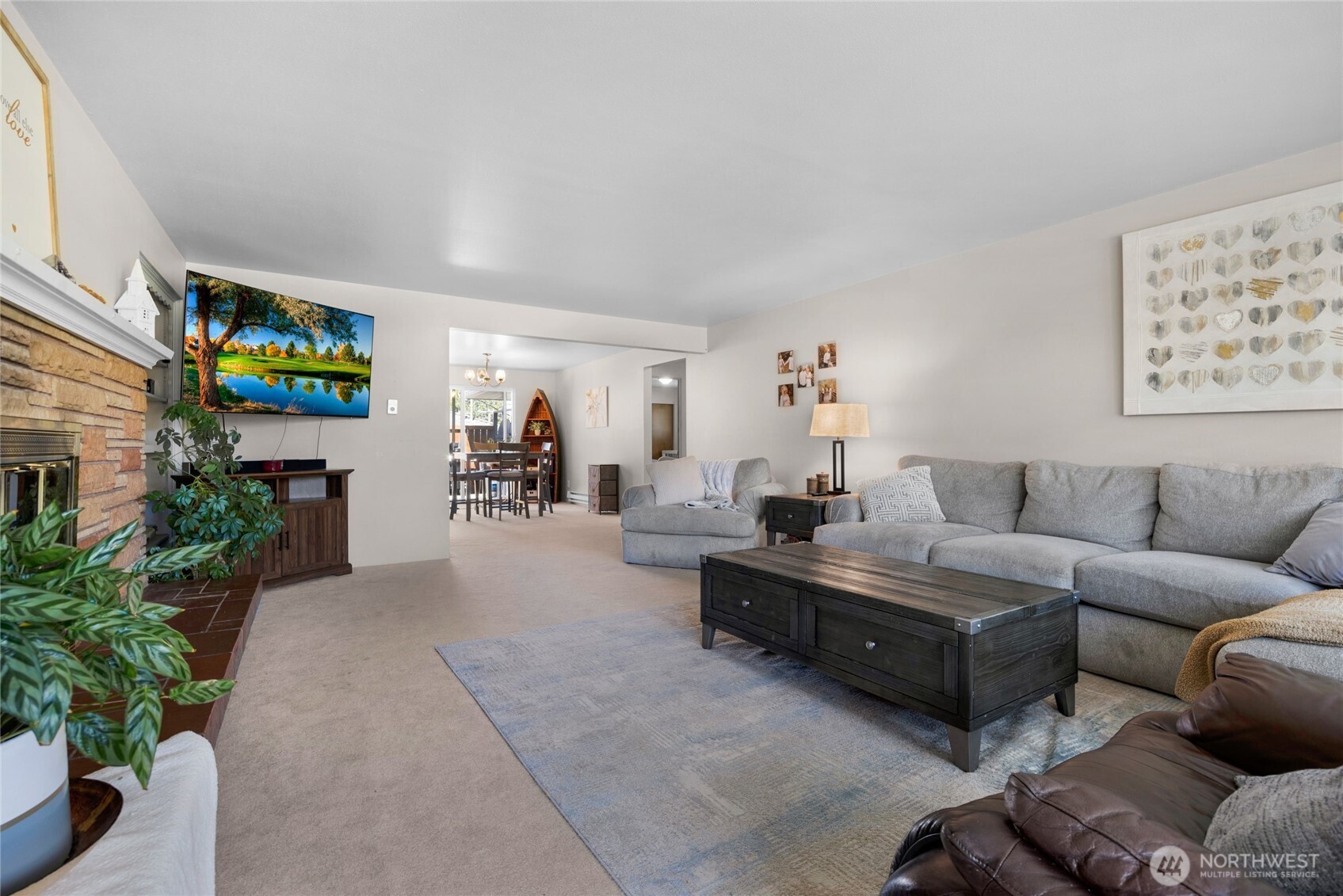 205 Heather Road Everett, WA 98203 - Photo 28 of 40 a living room with furniture and a flat screen tv