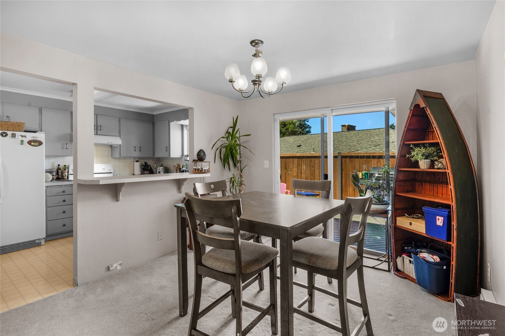 205 Heather Road Everett, WA 98203 - Photo 31 of 40 a view of a dining room with furniture and a chandelier