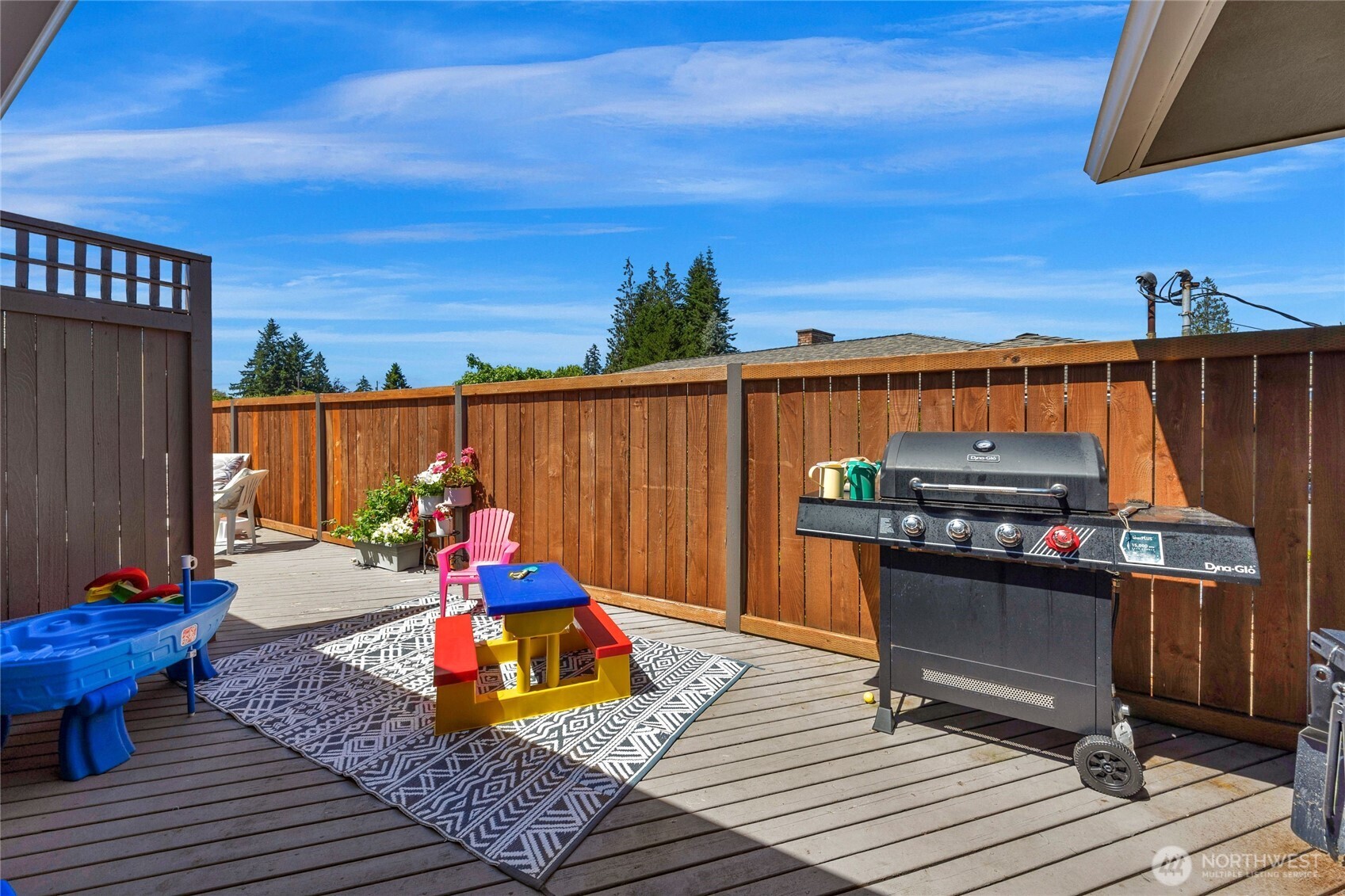 205 Heather Road Everett, WA 98203 - Photo 32 of 40 a backyard of a house with barbeque oven table and chairs