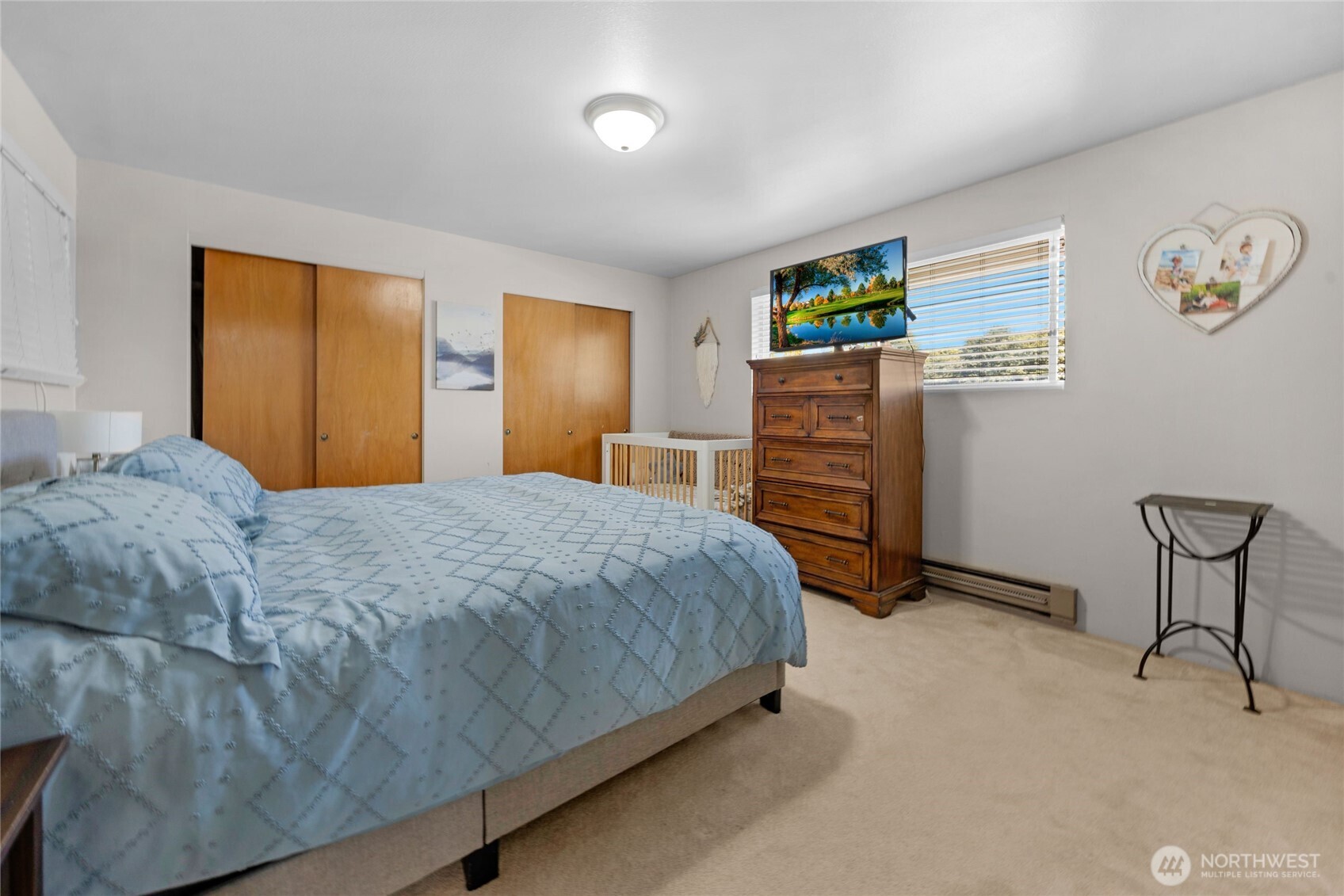 205 Heather Road Everett, WA 98203 - Photo 34 of 40 a bedroom with a bed and cabinets