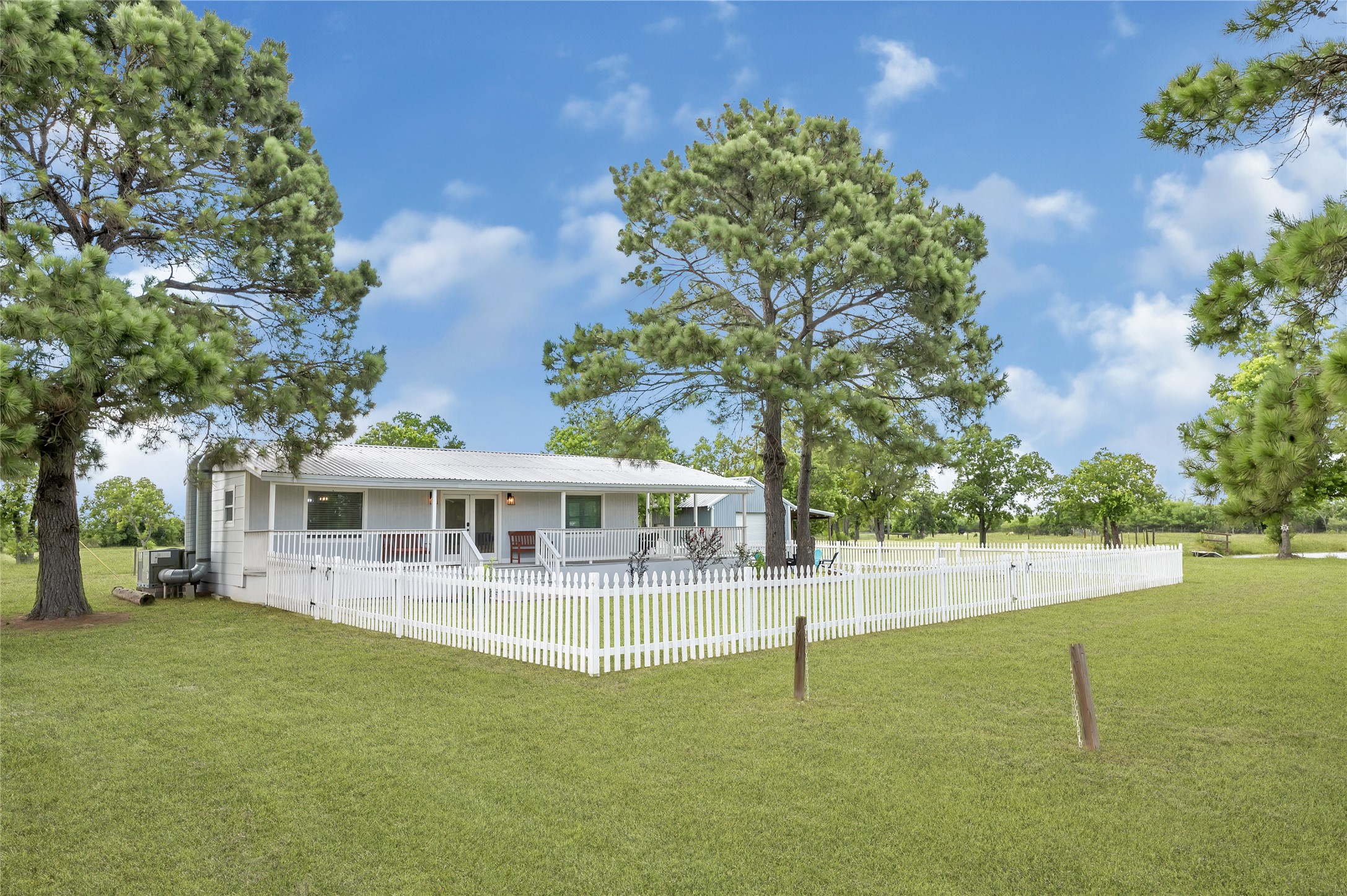 868 Lisa May Road Bellville, TX 77418 - Photo 10 of 39 A beautifully maintained cabin that offers a peaceful sanctuary amid the vast acreage.