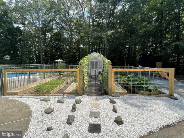 swimming pool view with a seating space