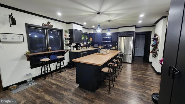 a living room with fireplace furniture and a chandelier