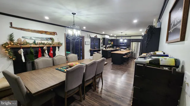 a large kitchen with a table and chairs