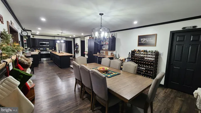 a living room with lots of furniture and a flat screen tv