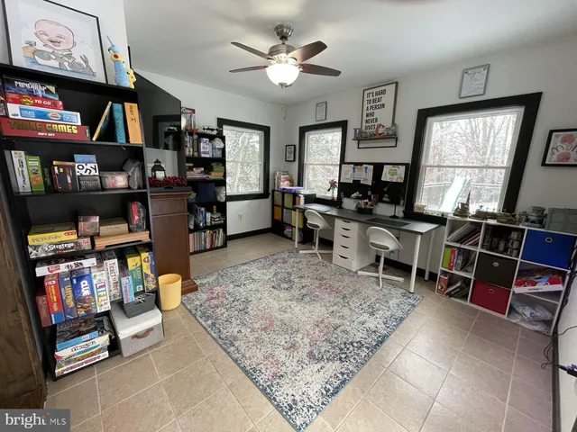a room with furniture a rug and a window