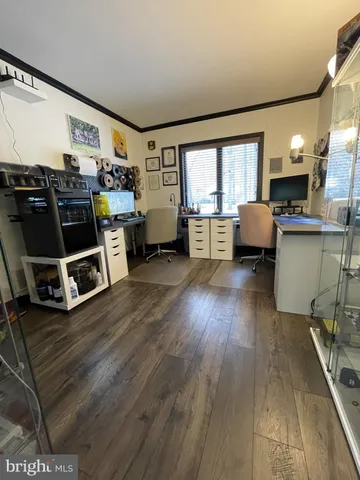 a bedroom with a bed and a mirror