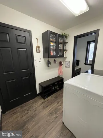 a white toilet sitting next to a bathroom sink