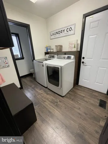 a bathroom with a sink a mirror and a vanity
