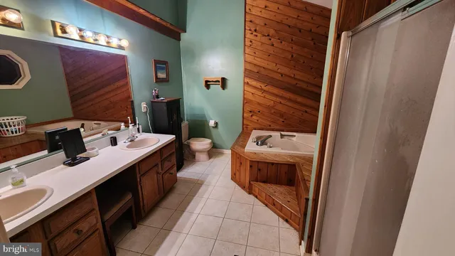 a spacious bedroom with a bed and a window