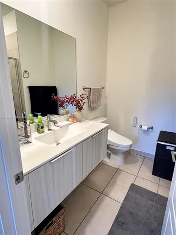 a bed room with bed and a window