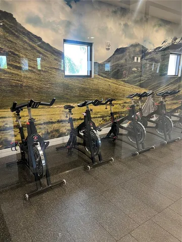 a living room with furniture a fireplace and a window