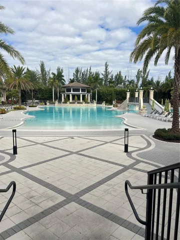 a swimming pool with outdoor seating yard and barbeque oven