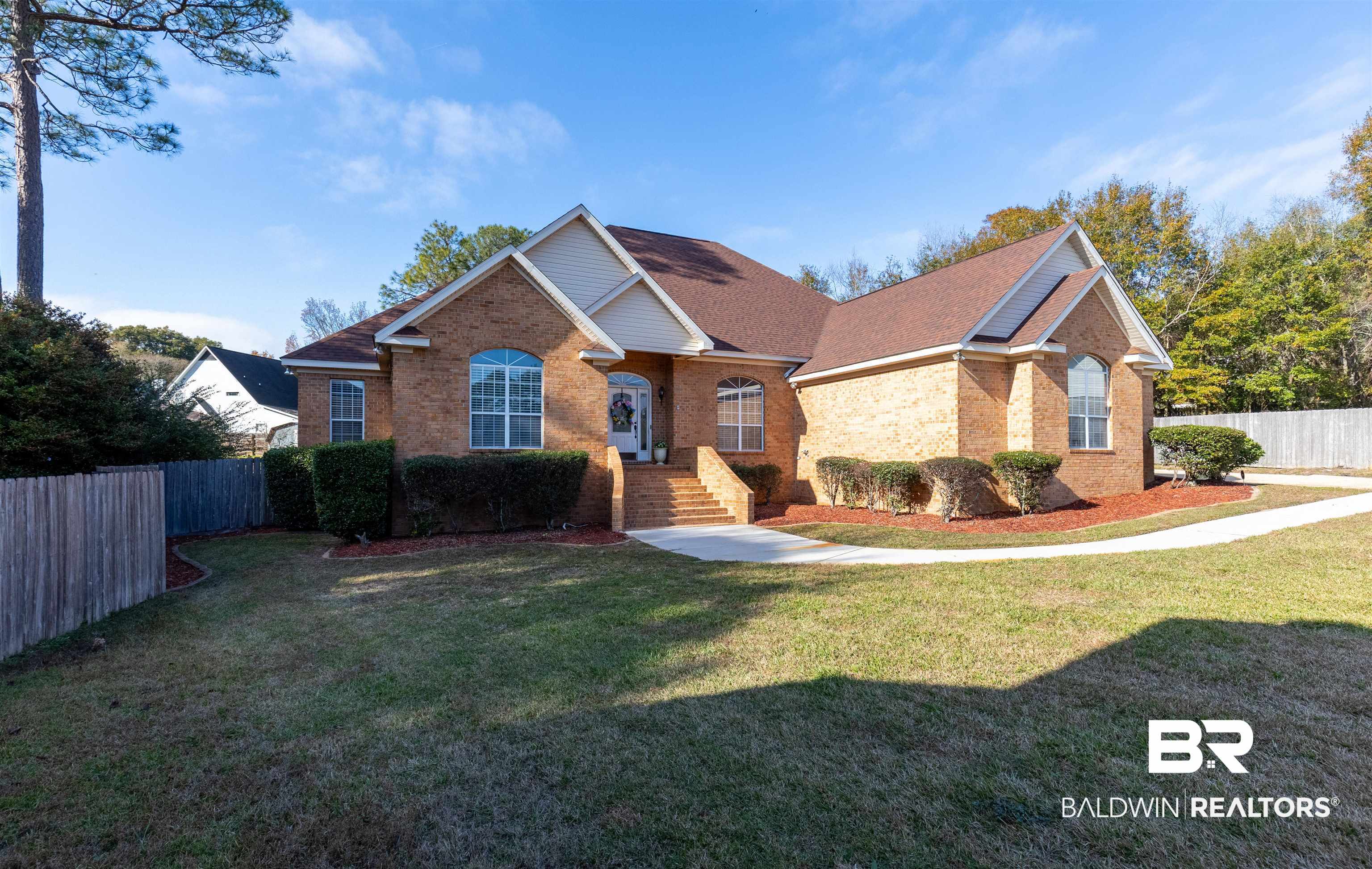 6436 Cherry Ridge Court West Mobile, AL 36695 - Photo 1 of 26 View of front of house featuring a front yard, fence, and brick siding