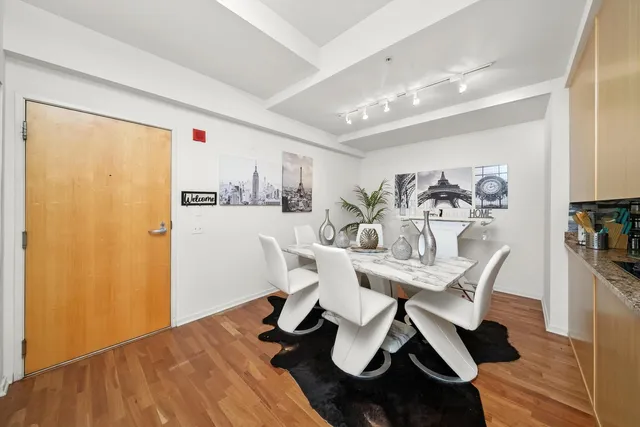 a view of a dining room with furniture and wooden floor