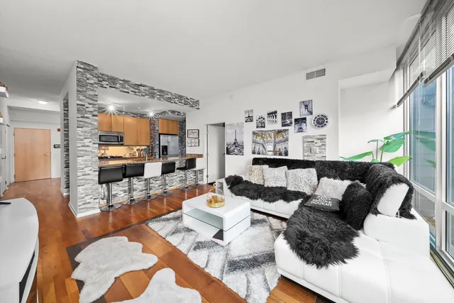 a living room with furniture and a large window