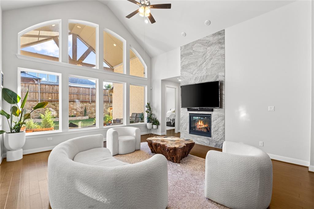 3516 Ithaca Street Corinth, TX 76208 - Photo 11 of 40 a living room with furniture a flat screen tv and a large window