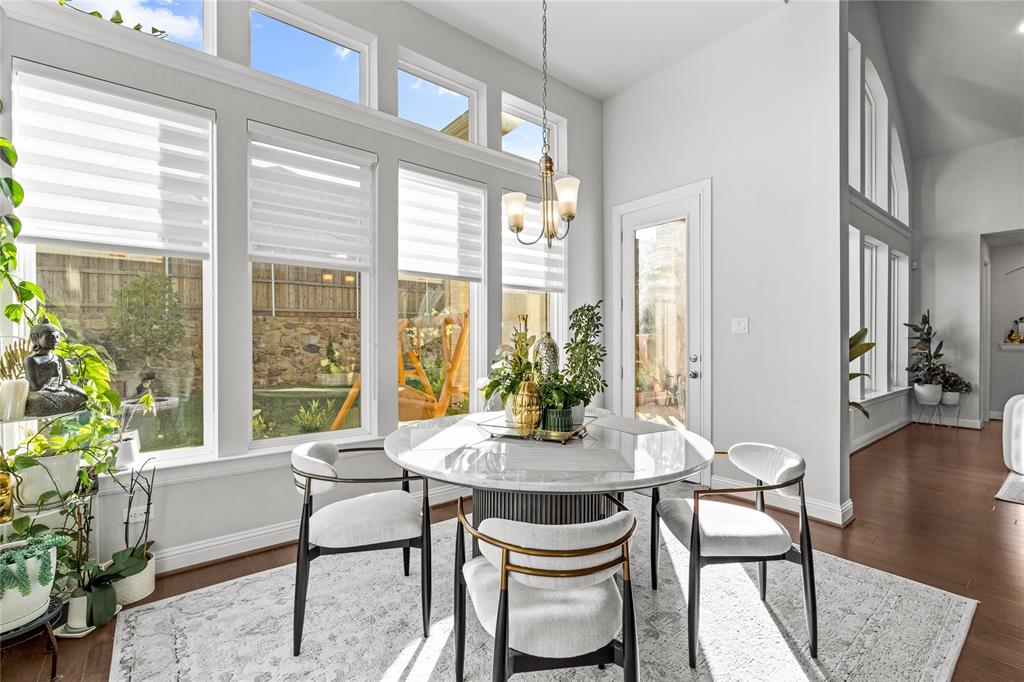 3516 Ithaca Street Corinth, TX 76208 - Photo 17 of 40 a view of a dining room with furniture window and wooden floor