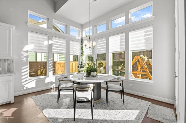 a spacious bathroom with a shower sink and mirror
