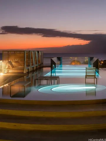 a view of swimming pool with outdoor seating