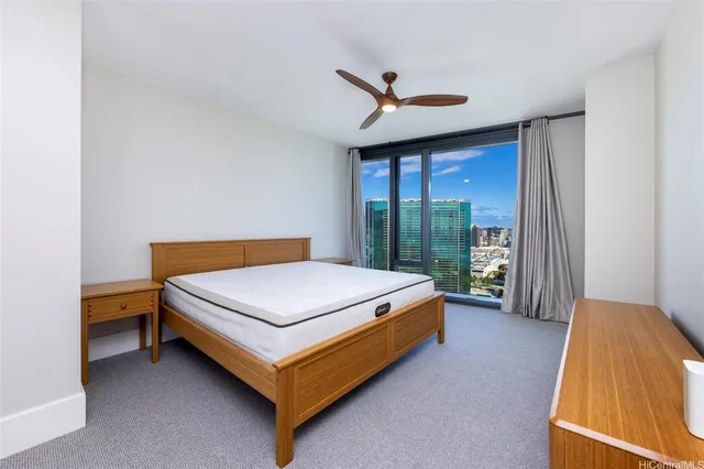 a bed sitting in a room next to a window