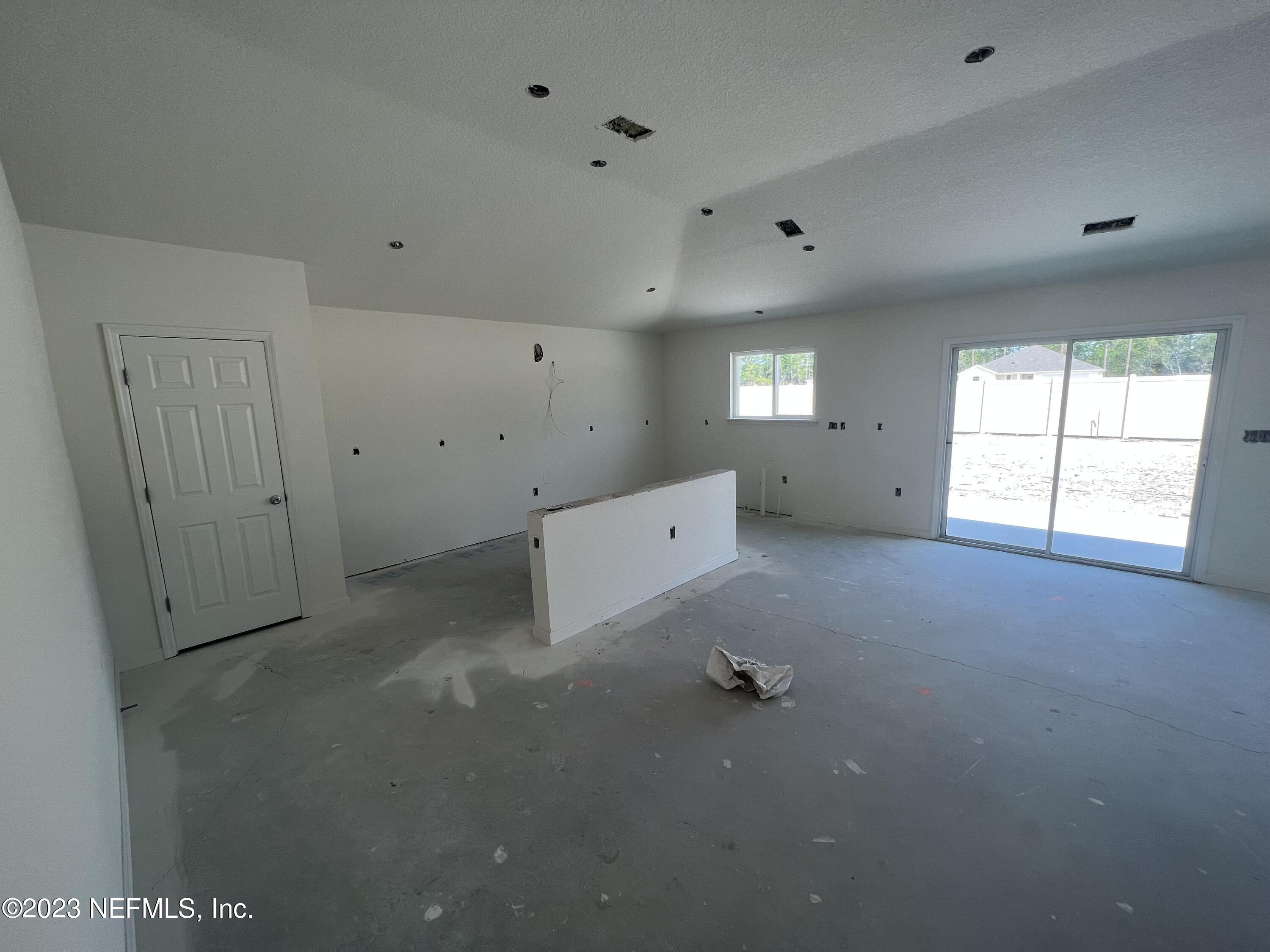 241 Sangria St. Augustine, FL 32086 - Photo 3 of 10 an empty room with windows and cabinet